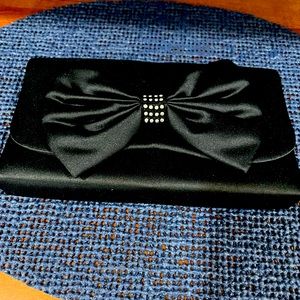 Vintage woman’s Black Satin clutch with rhinestone bow. Braided shoulder strap